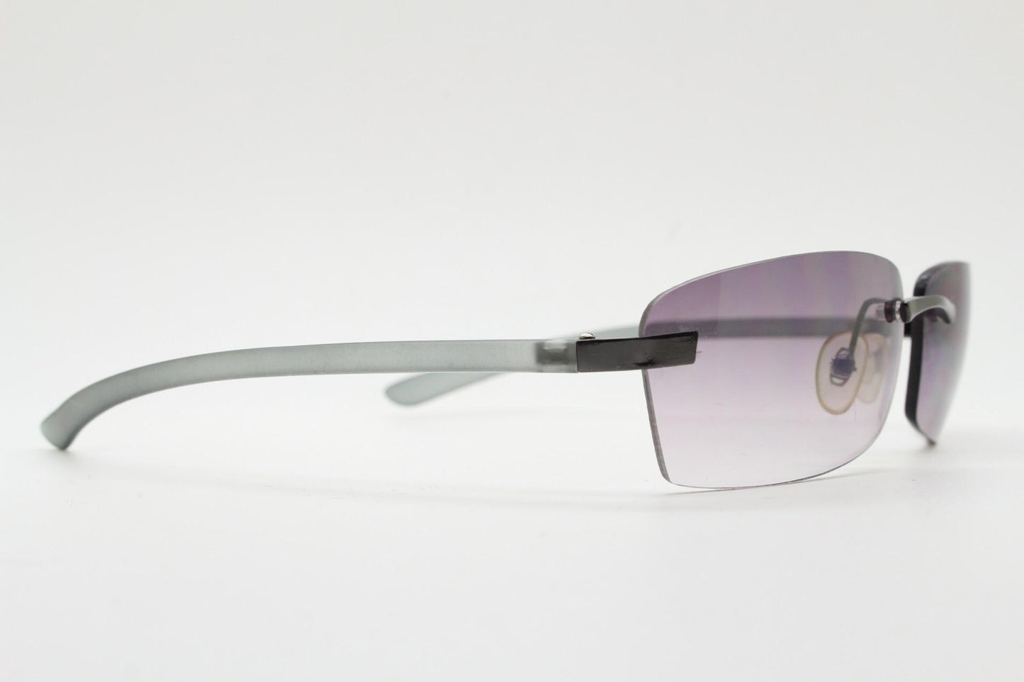 90s vintage minimal frameless sunglasses. Minimal mulberry rectangular lenses with gunmetal grey trim and frosted arms. Matrix shades
