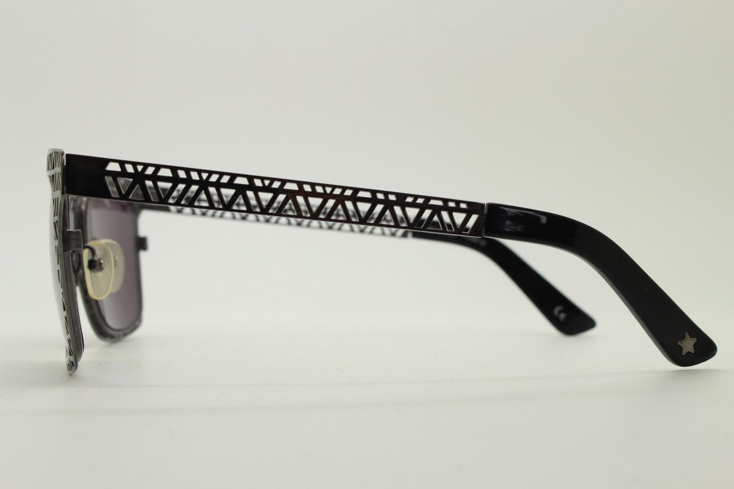 Sass and bide vintage wayfarer shape sunglasses. Gunmetal grey flat metal frame with cut out patterns throughout and black lenses. 2000s NOS