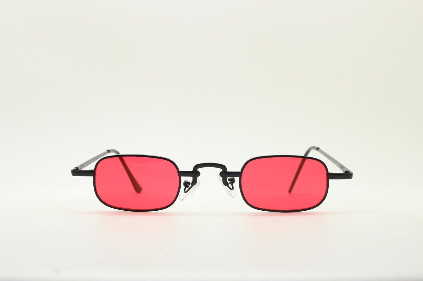 90s vintage small rectangular sunglasses. Imposing minimal black metal victorian style frame with deep red lenses. Unused BNWT