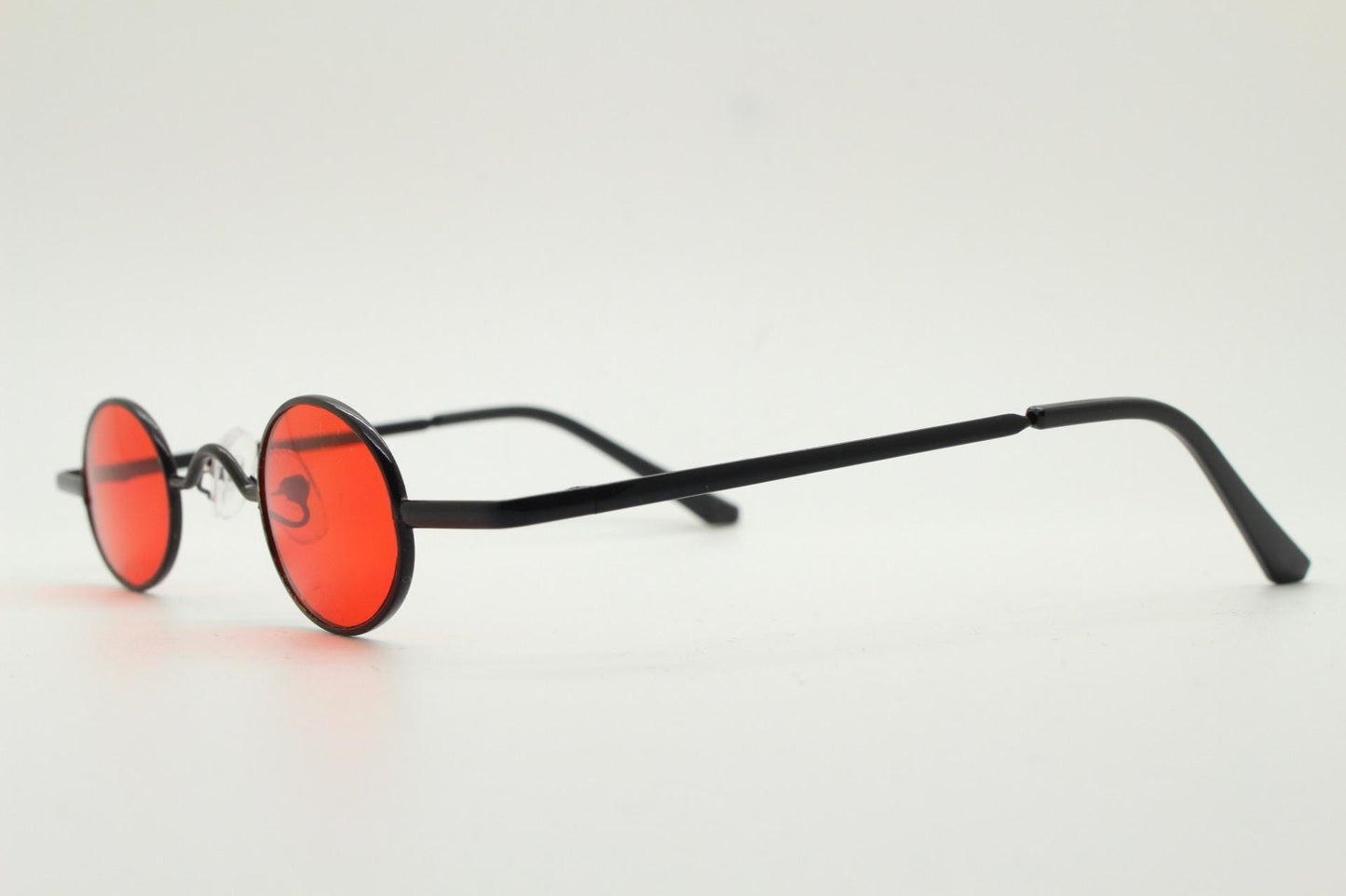 90s vintage small oval sunglasses. Imposing minimal black gloss metal victorian antique style frame with bright red lenses. Steampunk. NOS