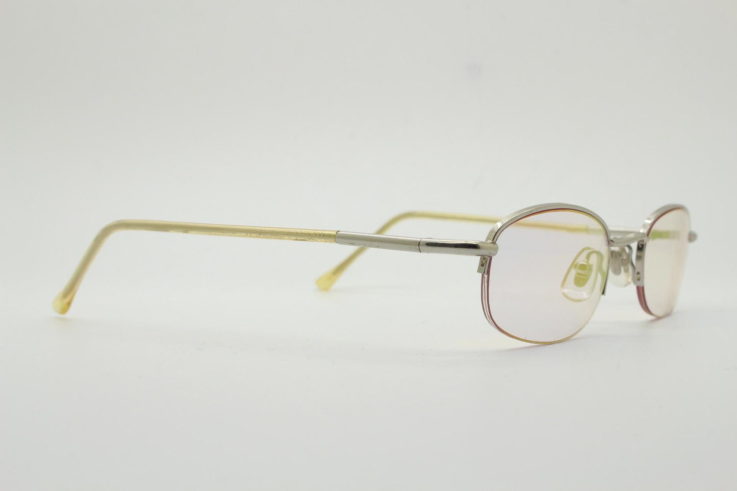 90s vintage small rectangular sunglasses. Silver chrome half frame with light tone lenses with gold mirror glaze. 2000's. Y2K. NOS micro