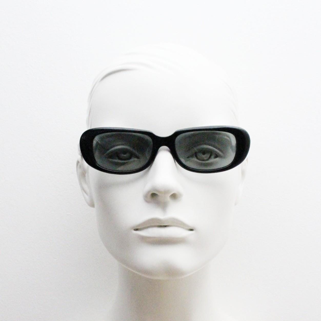 Polaroid 60s vintage rectangular sunglasses made in England. Authentic plain black frame with atmospheric curved lenses. Mens mod