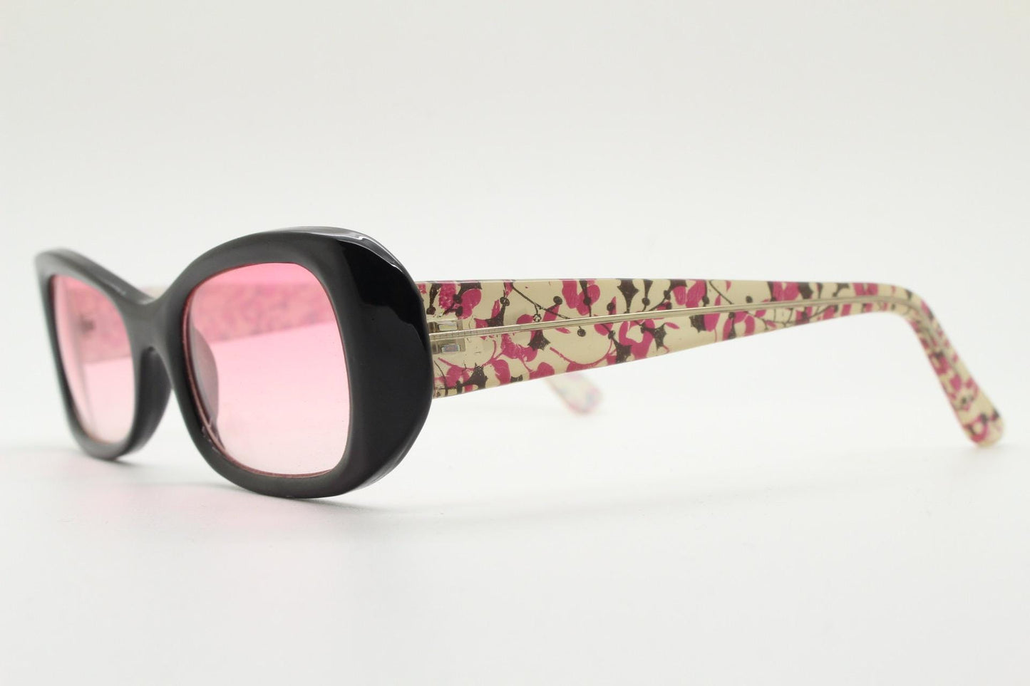 Y2k vintage rectangular cat eye sunglasses. Intense 60s style black front with pink lenses and extraordinary floral arms. 2000s NOS. BNWT