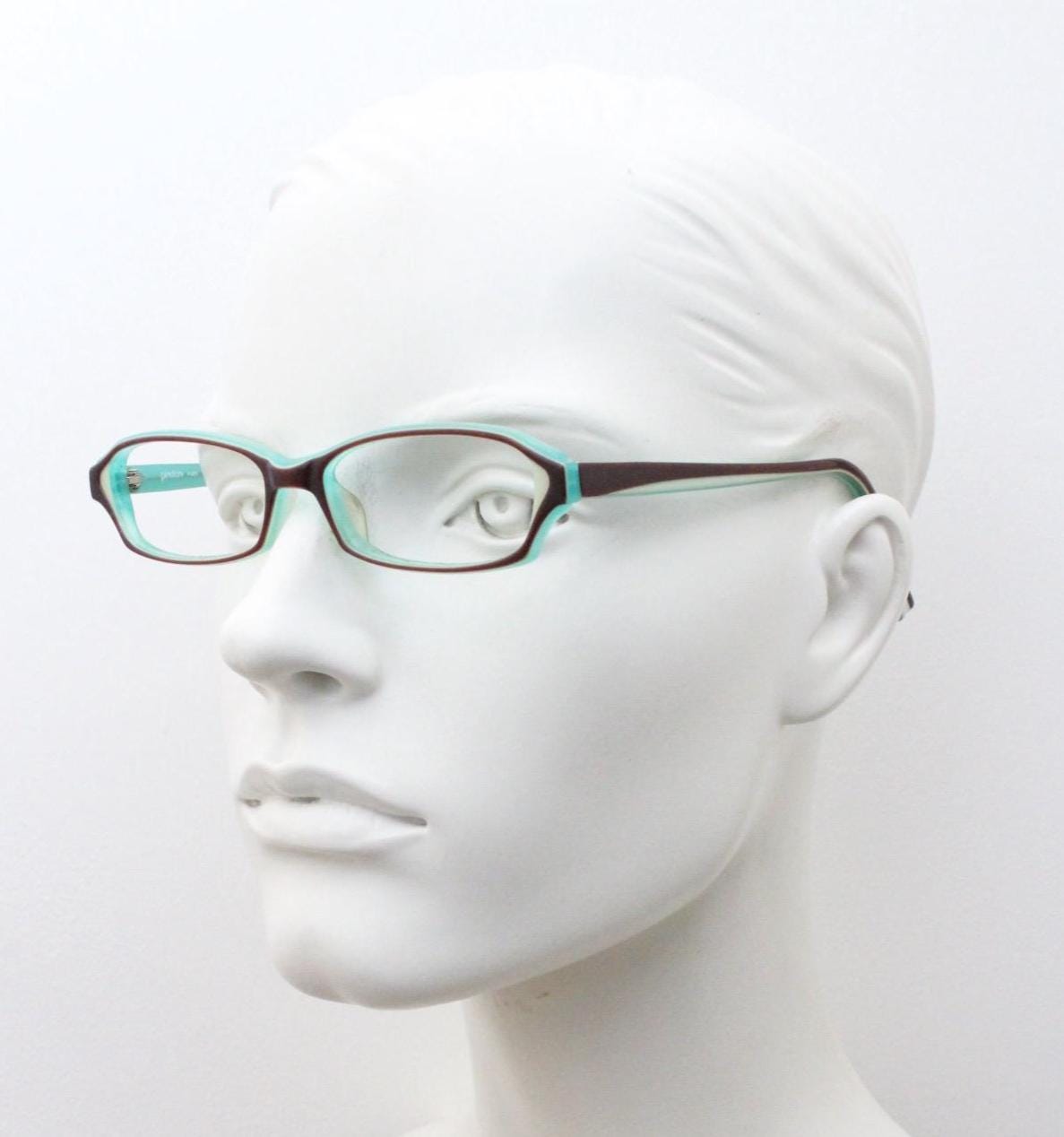 Francois Pinton Paris rectangular cat eye glasses made in Italy. Womens vibrant green acetate optical frames with brown front. Vintage