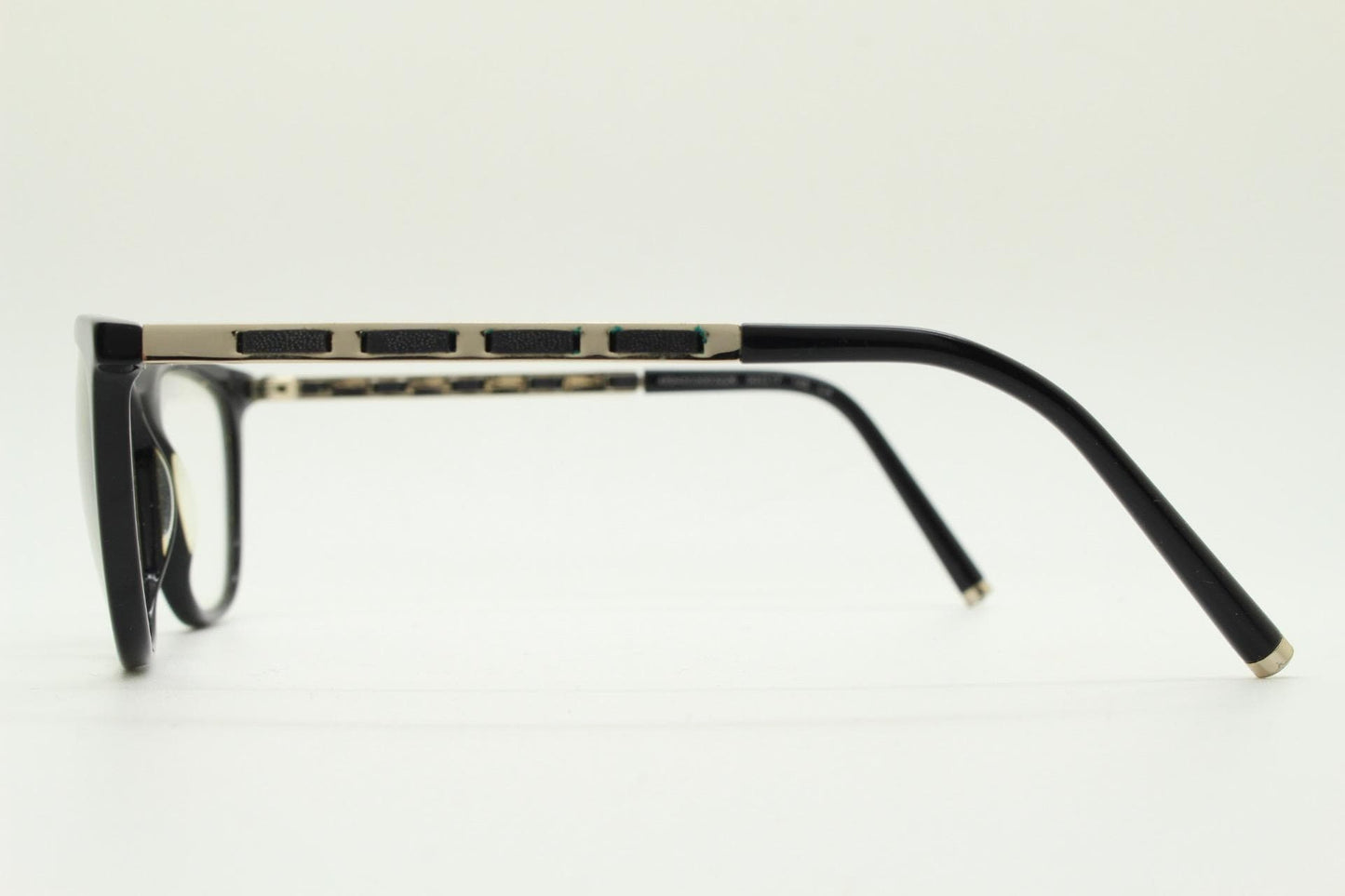 Vintage elegant cat eye glasses by Heritage. Black gloss acetate optical frames with leather lattice arms. Prescription RX cateye spectacles