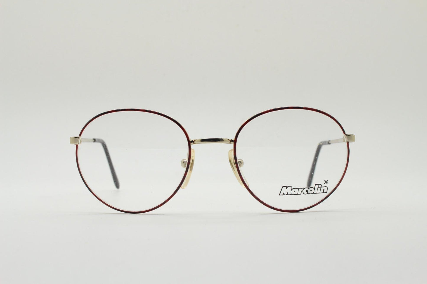 Marcolin 90s vintage round metal eye glasses made in Italy. Panto shape optical frames with attractive red and black front. Prescription RX