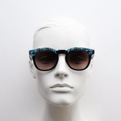80s vintage rounded wayfarer design sunglasses. Abstract patterned blue brow and arms on a black frame with graduating  lenses. Unused NOS