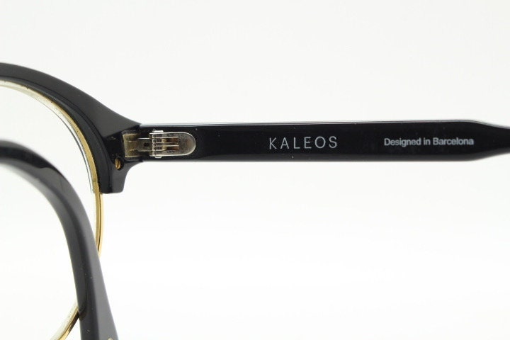 Kaleos round half frame eye glasses. Black gloss acetate browline optical frames with gold underwire. Prescription eyeglasses. RX