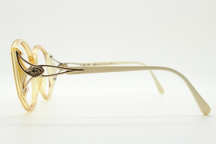 Christian Dior 70s vintage big round eye glasses made in Austria. Brown Optyl optical frames with distinctive logo. Prescription RX. NOS