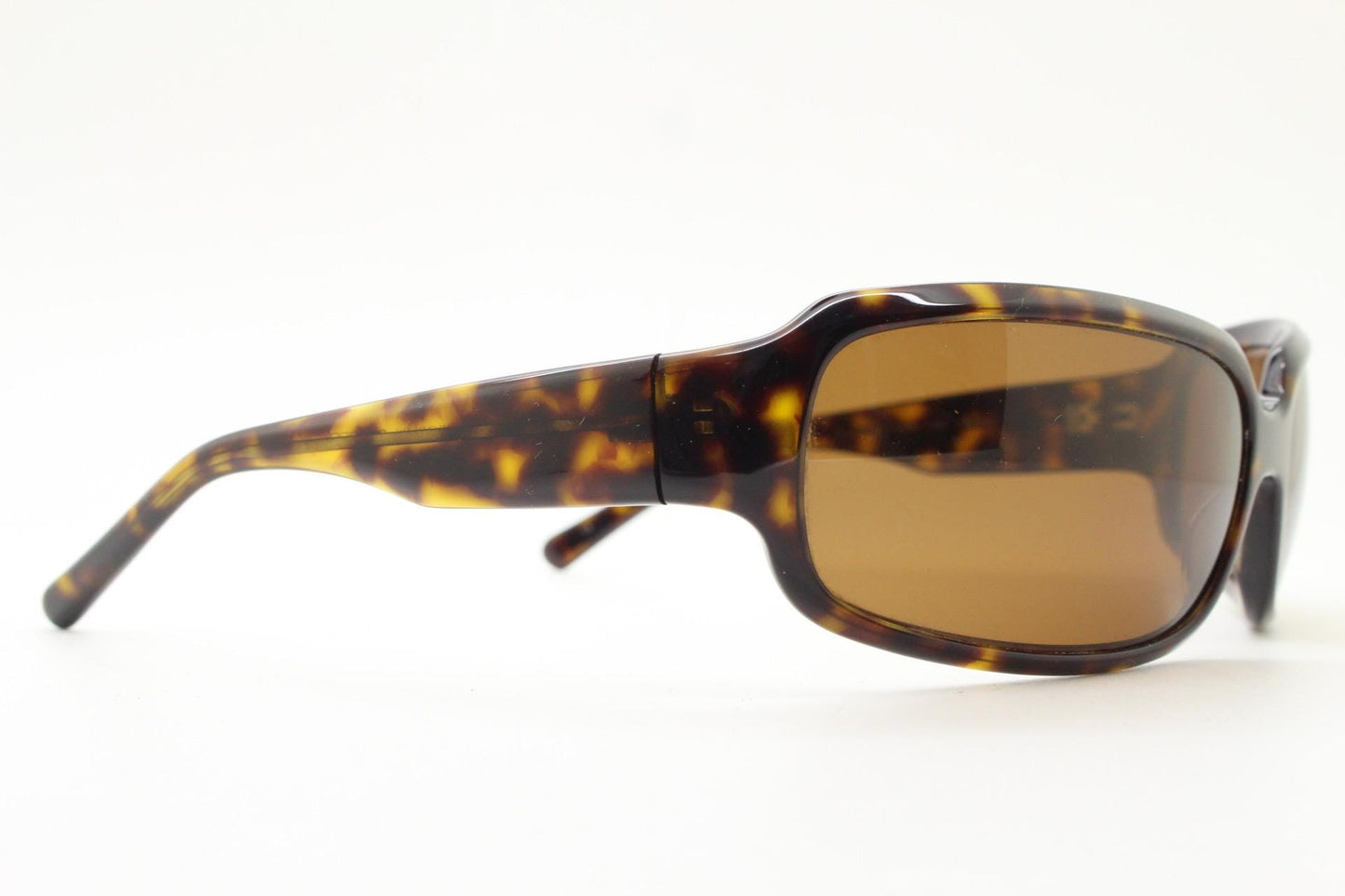 Oliver Peoples vintage Y2K wrap around sunglasses model Impala made in Japan. Curved bug eye in mottled brown tortoise acetate