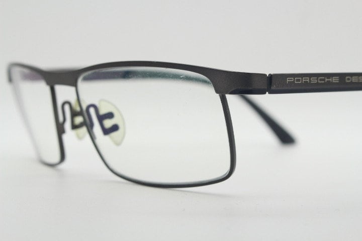 Porsche design rectangular eye glasses model 8251 made in Japan. Minimal gunmetal grey wire optical frame. Prescription RX spectacles