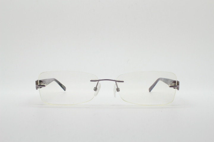 Givenchy rectangular frameless eye glasses made in Italy. Minimal optical frame with marbled brown arms. Prescription RX spectacles. Vintage