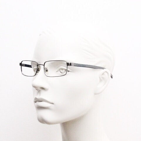Calvin Klein collection rectangular eye glasses model 582 made in Japan. Gunmetal grey wire optical frames. Prescription eyeglasses. RX