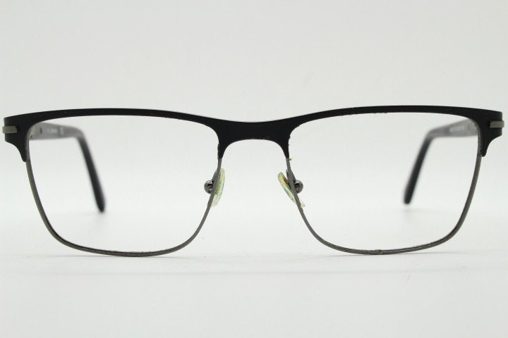 Calvin Klein rectangular eye glasses. Gunmetal grey chrome wire optical frames with black matt brow. Prescription eyeglasses. RX Spectacles