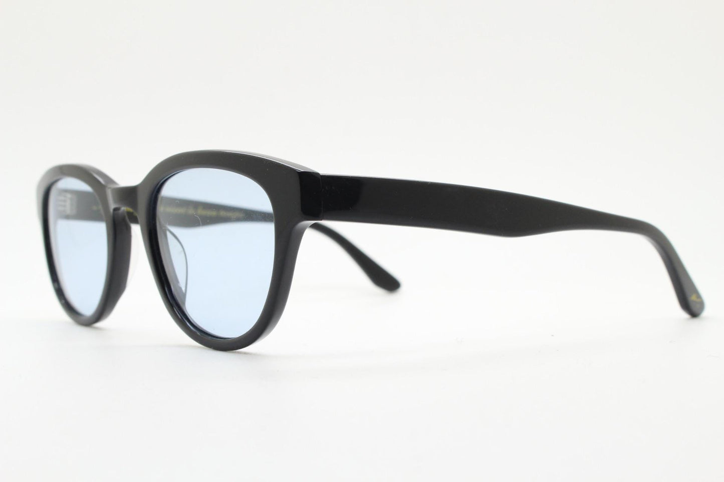 Vintage modified wayfarer design sunglasses. Black gloss acetate frame with extra light tone blue lenses in ideal proportions. NOS