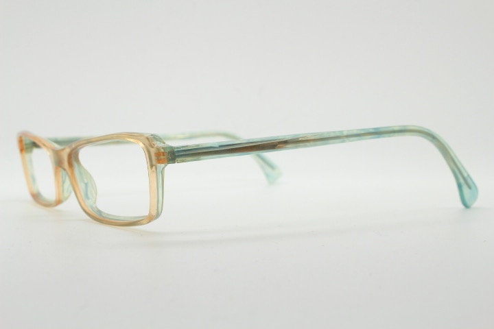 Alain Mikli rectangular eye glasses hand made in France. Low profile slim peach and blue transparent acetate optical frame. Prescription RX.