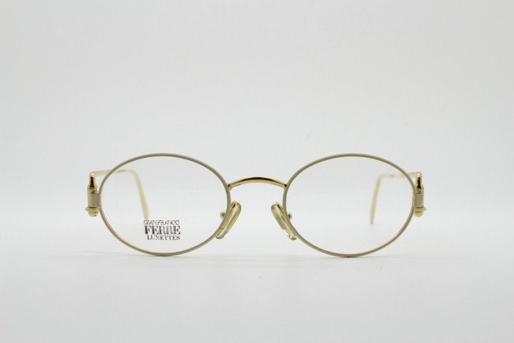 Gianfranco Ferre 90s vintage oval eye glasses made in Italy. White and gold metal tech design optical frame. Prescription RX spectacles. NOS