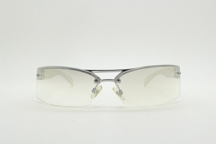 Y2K vintage wraparound sunglasses. Sick fashion grail half frame in silver chrome with extra light tone curving mirrored lenses. 2000's NOS