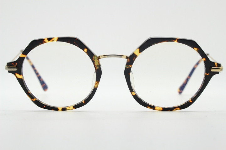 Kaleos hexagon eye glasses model Trevethyn made in Italy. Amber tortoise acetate optical frames with gold arms. Prescription eyeglasses. RX