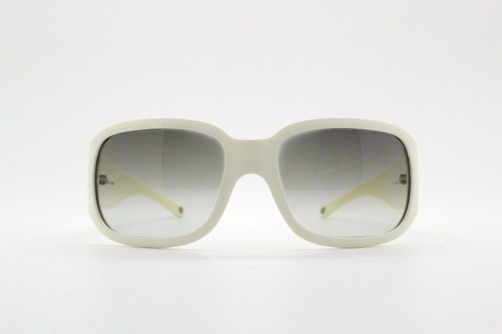 Versace Y2k vintage wrap around bug eye sunglasses. Curving white acetate shield frame with huge spell out diamante logo. 2000s. Rhinestone