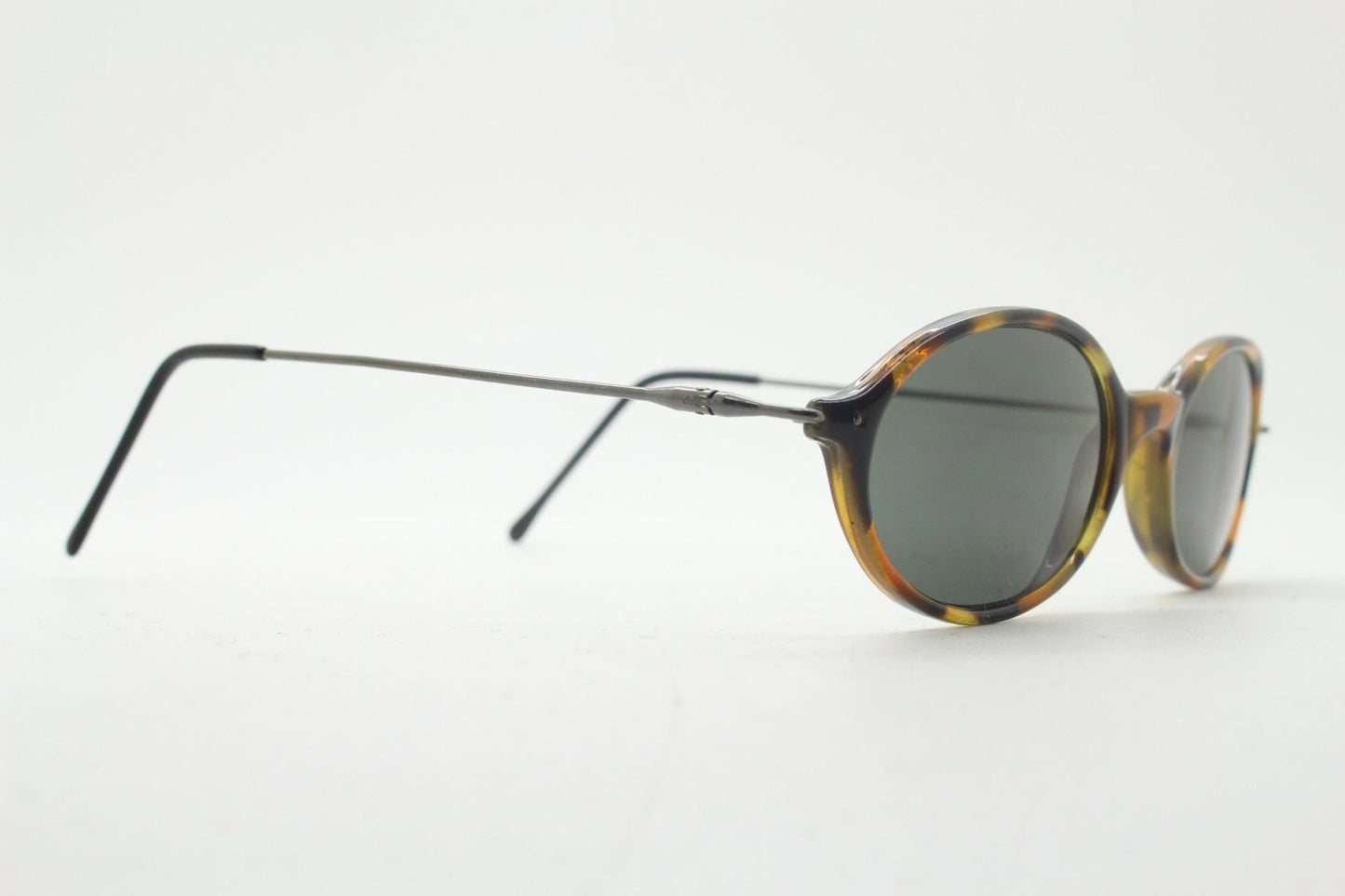 90s vintage oval sunglasses. Honey tortoise frame with refined slim 'industrial tech' style arms. Micro. Unused NOS