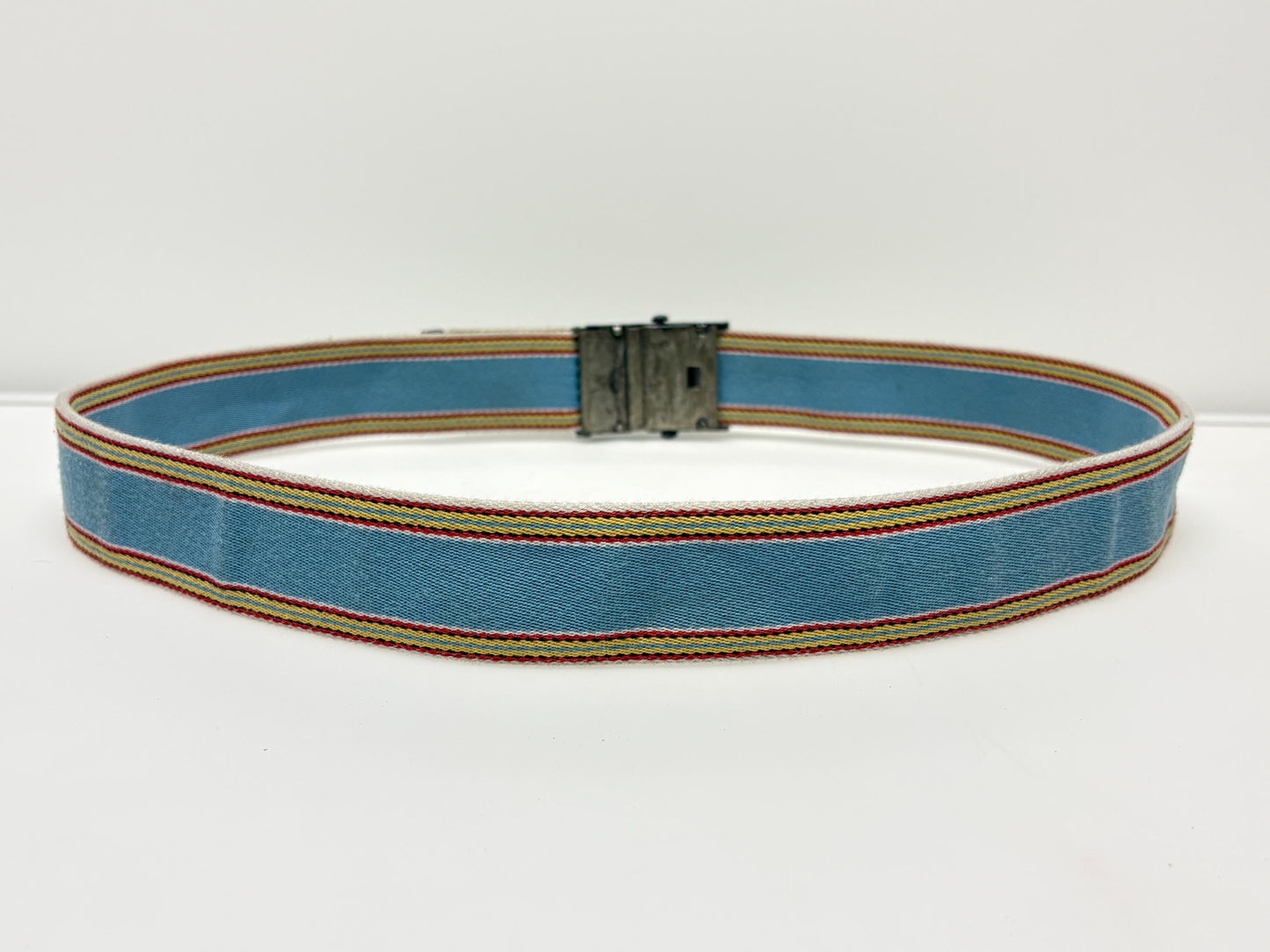 Y2K vintage 2' canvas army style belt in sky blue with red, white and yellow rainbow stripes. 2000s Mens large. Fully adjustable size range