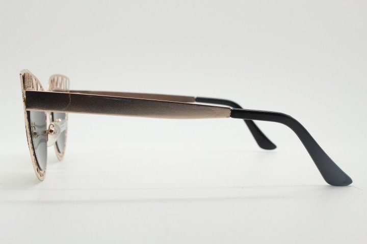Y2K vintage metal cat eye sunglasses. Women's extraordinary gold cut out lattice scaffold cateye frame with gold mirror lenses. 2000s. BNWT