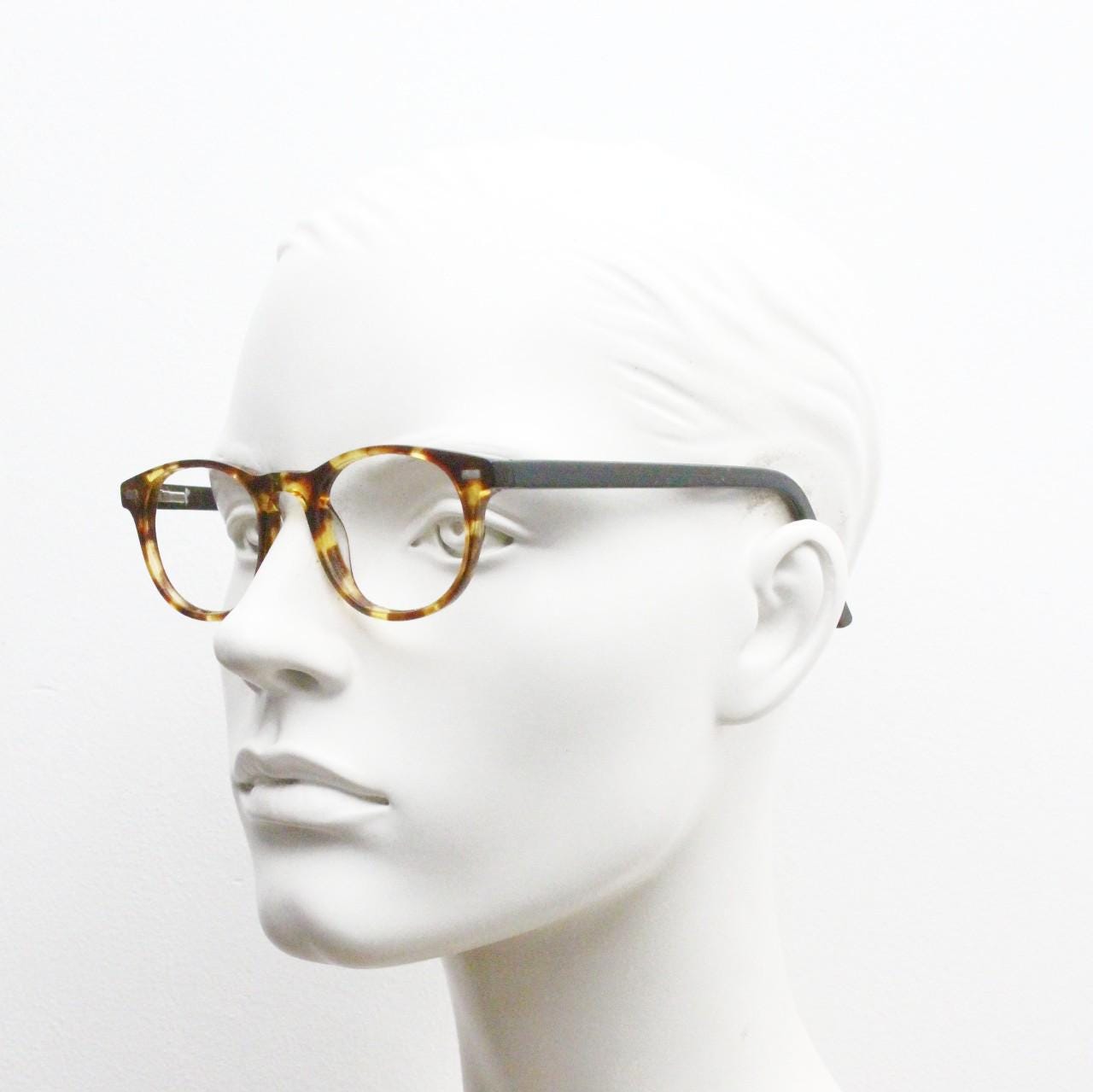 90s Vintage oval eye glasses. Tortoise gloss solid acetate 40s design optical frames with plain black arms. Prescription RX spectacles