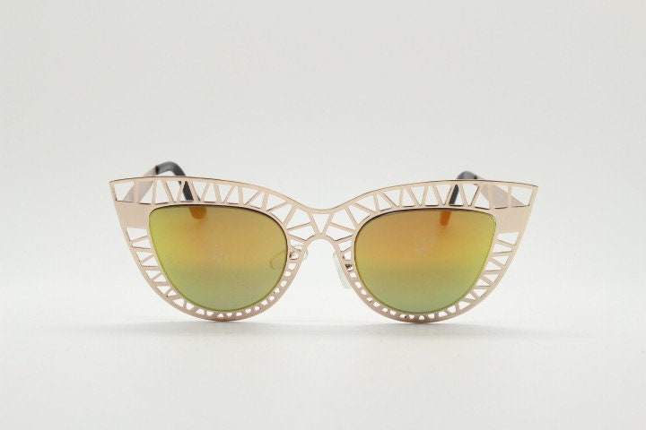 Y2K vintage metal cat eye sunglasses. Women's extraordinary gold cut out lattice scaffold cateye frame with gold mirror lenses. 2000s. BNWT