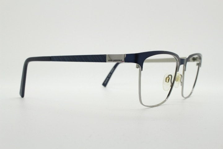Karl Lagerfeld squared wayfarer shape eye glasses. Navy check pattern arms with satin finish brow optical frames. Prescription eyeglasses.