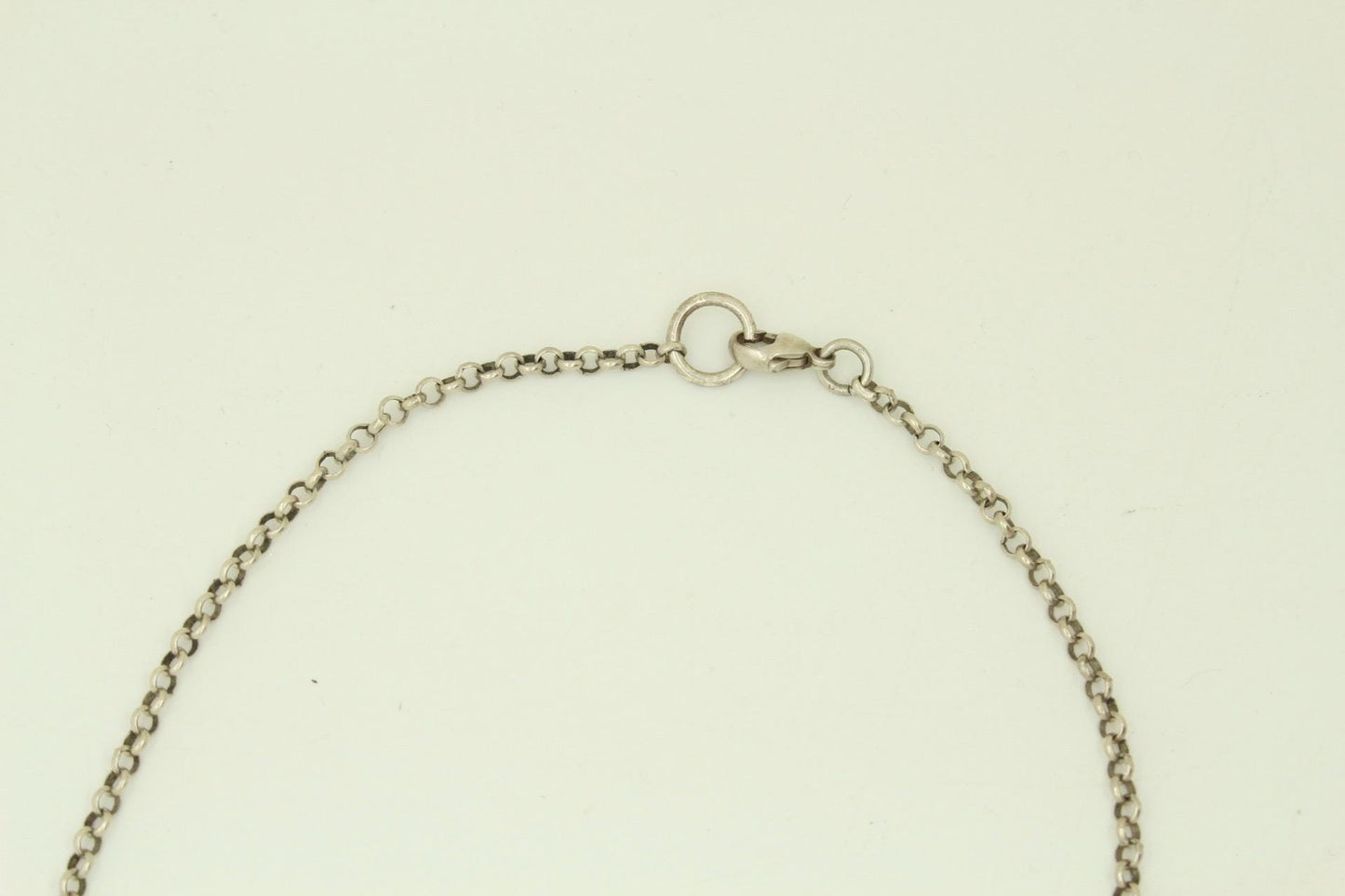 90s vintage Harley Davidson Motorcycles disc pendant necklace. Solid metal silver curved shield with standout skull on adjustable chain