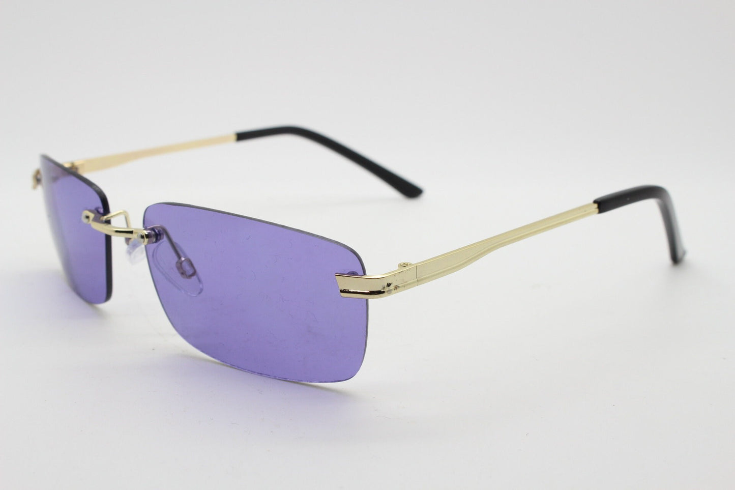 Y2K vintage frameless purple sunglasses. Rectangular lenses with gold bridge and arms. 2000s club kids. 00's. 90s Rave