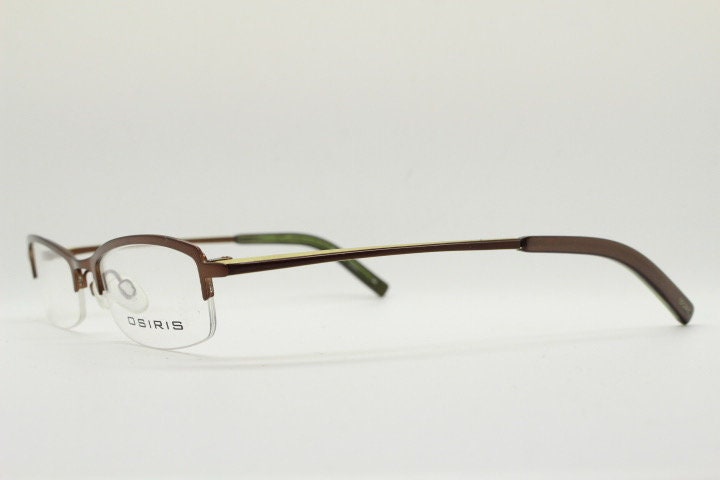 Osiris 90s vintage rectangular half rim eye glasses. Low profile optical frame in handsome brown chrome. Prescription RX Spectacles