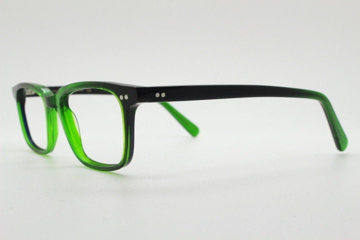 Green rectangular low profile wayfarer design eye glasses by found of Switzerland. Green gloss acetate optical frames. Prescription RX