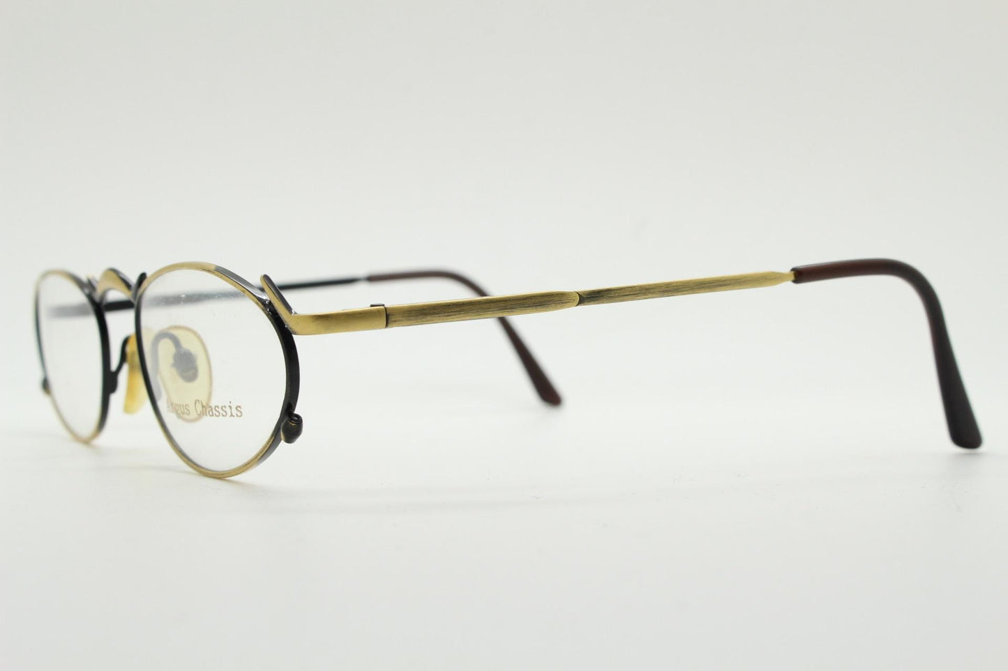 90s vintage oval eye glasses by Argus Chassis. Brushed bronze optical frames with dynamic spikes. Prescription cosplay fetish spectacles NOS