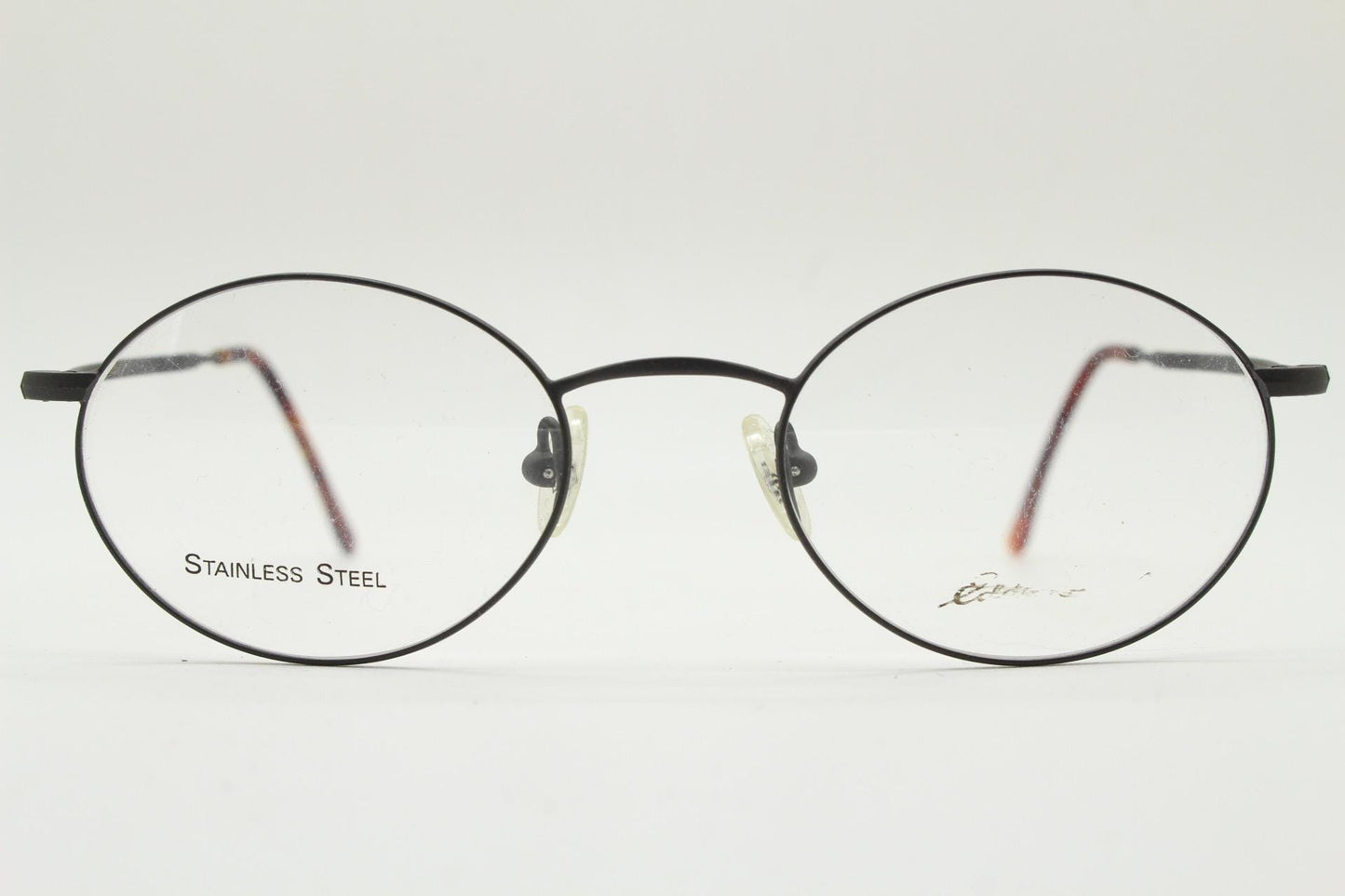Eddie Bauer 90s vintage oval eye glasses. Minimal black matt finish optical frames with kinked arms. Stainless steel spectacles. NOS