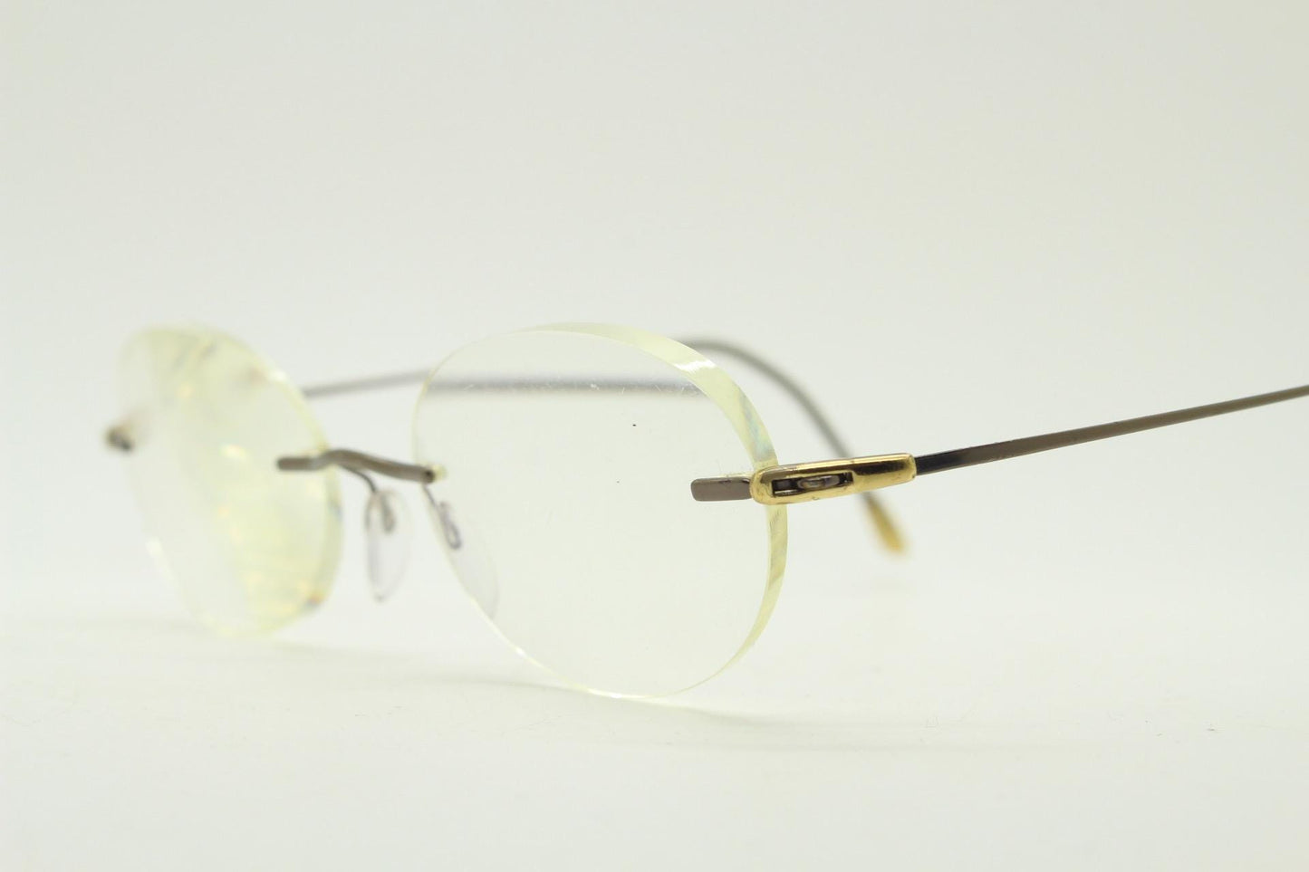 Silhouette vintage oval frameless eye glasses made in Austria. Minimal lightweight satin bronze optical frame. Prescription spectacles