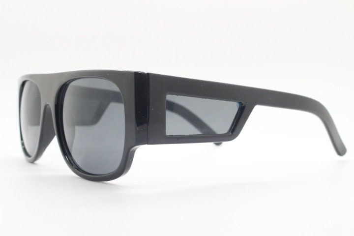 Y2K vintage rectangular side panel sunglasses. Black gloss frame with grey lenses and side window spoilers / blinkers. 2000s NOS goggle