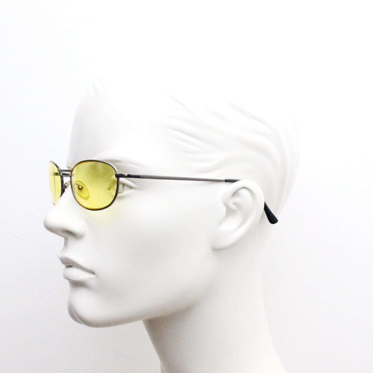 Y2K vintage small oval bug eye sunglasses. Gunmetal grey satin finish frame with blazing canary yellow lenses. Unused 2000s NOS. 90s micro