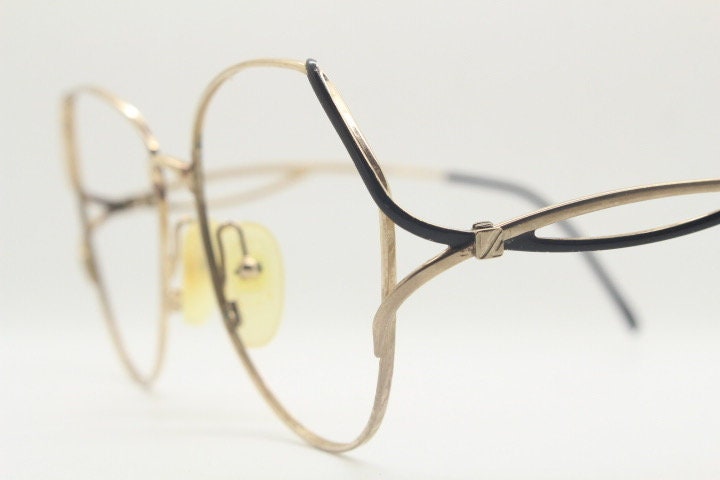 Viennaline 70s vintage angular round eye glasses. Slightly oversized subtle gold chrome optical frame with incredible arms. Prescription RX
