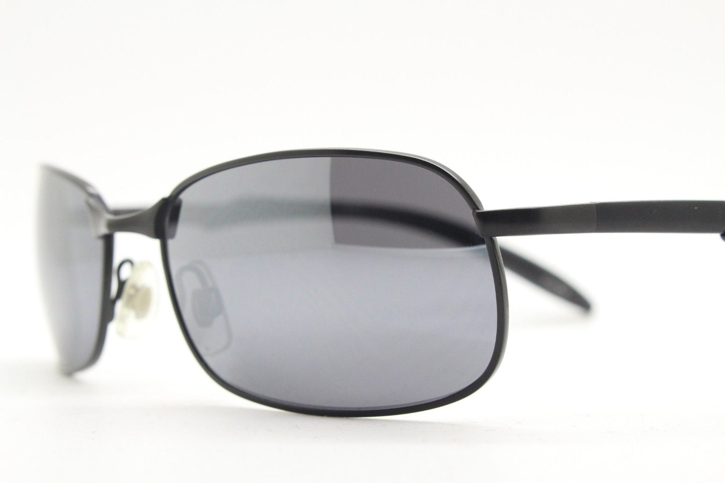Y2K vintage wraparound sunglasses. Black satin matt finish on rectangular frame with slight mirror glaze lenses. 2000's. 90s. Unused NOS