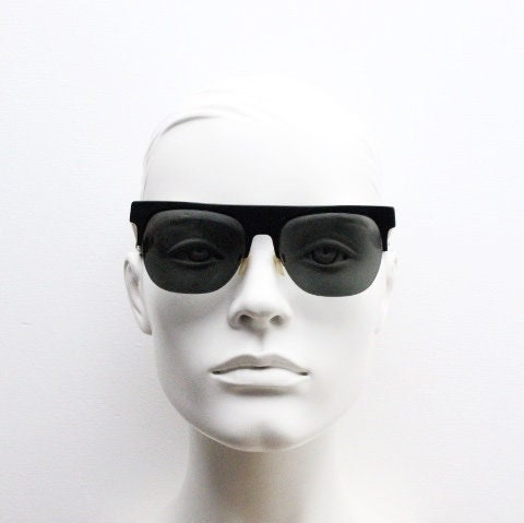 Retrosuperfuture vintage flat top half frame sunglasses hand made in Italy. Black gloss acetate front with tall golden arms