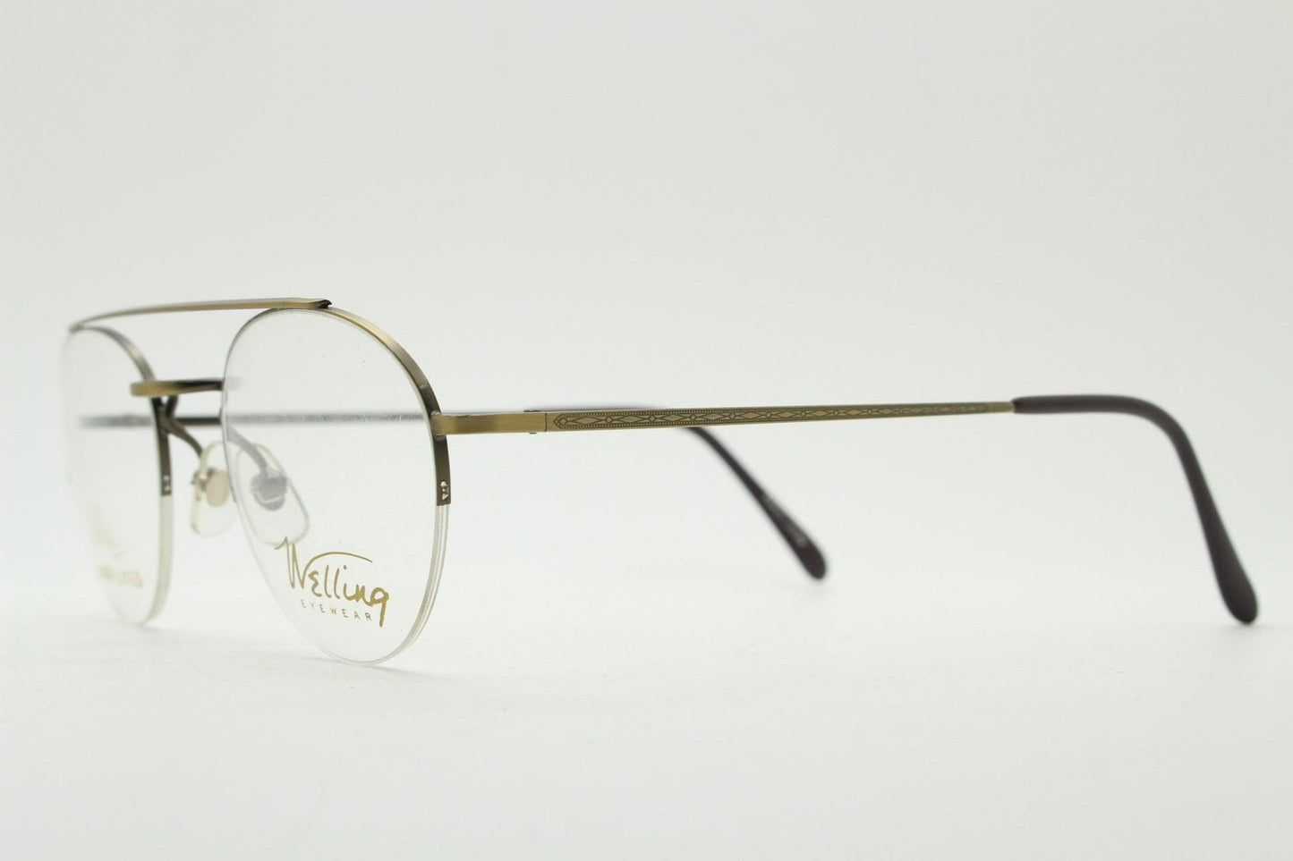 90s vintage round eye glasses made in Japan by Welling. Brushed bronze finish optical half frame. Prescription RX spectacles. NOS