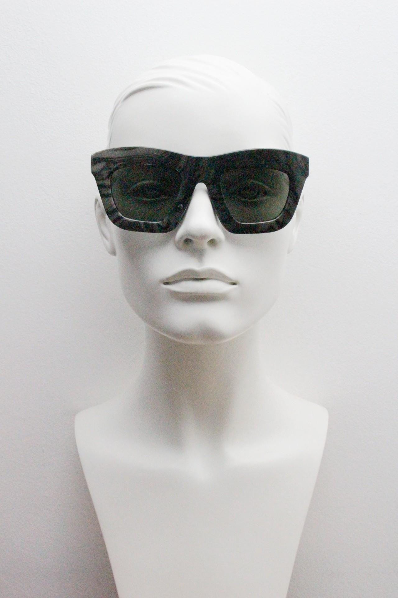 Cheap Monday thick frame cateye sunglasses. Womens chunky oversized grey and black marble cat eye with dark green lenses. Y2k vintage