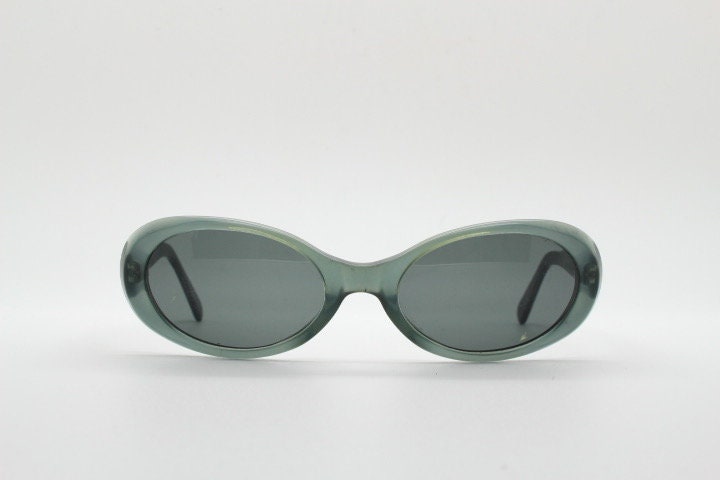 Giorgio Armani 90s vintage oval sunglasses made in Italy. Transparent grey\blue acetate frame with matching lenses. Small bug eye. Y2K
