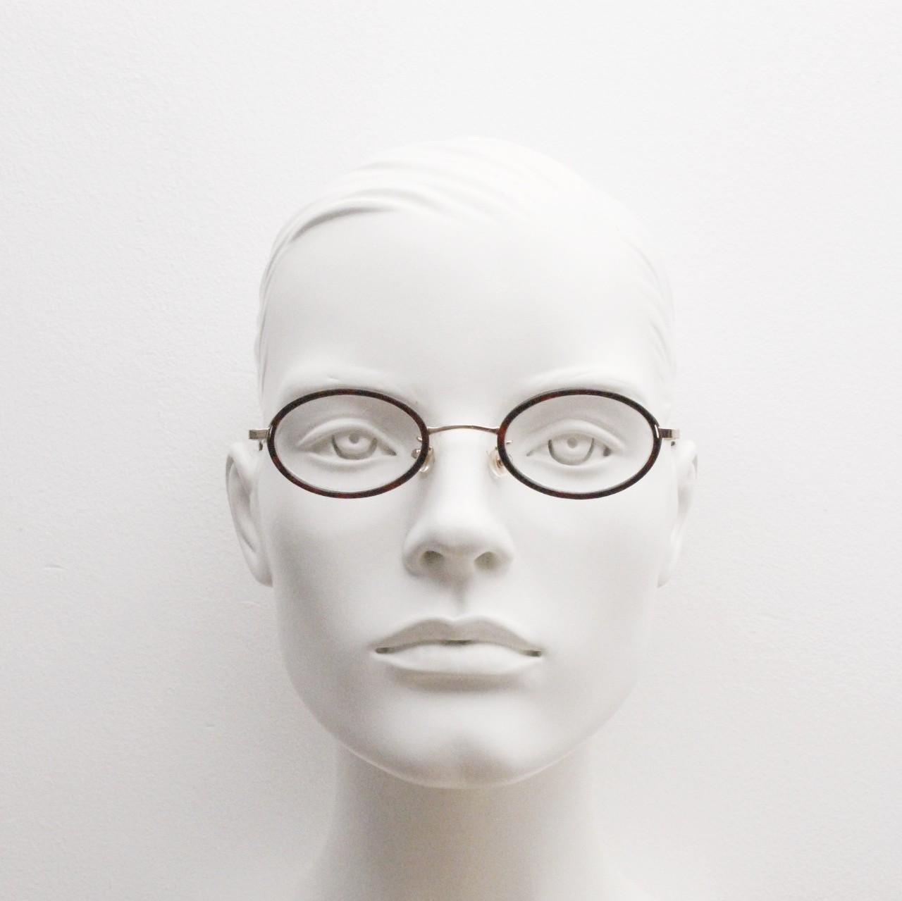 90s vintage small oval eye glasses. Gold metal frame 20s design optical frames with tortoise inserts and arms. Prescription. Spectacles NOS