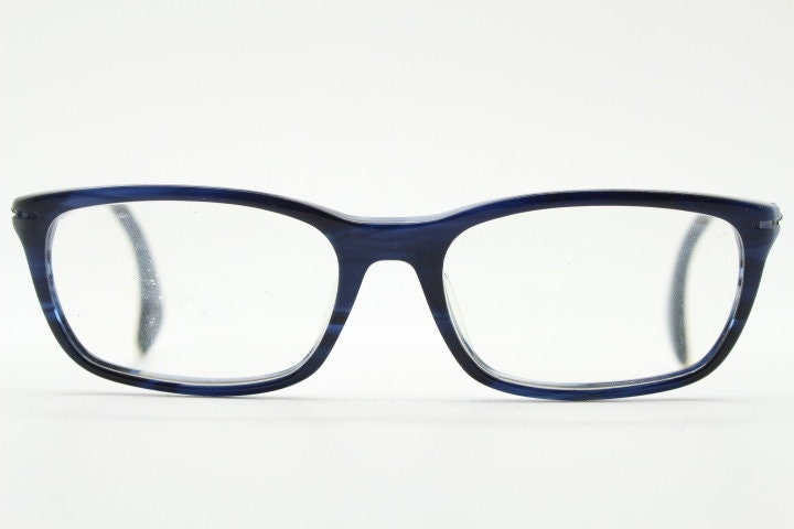 Calvin Klein rectangular low profile eye glasses. Dark navy blue gloss acetate optical frames. Prescription eyeglasses. RX