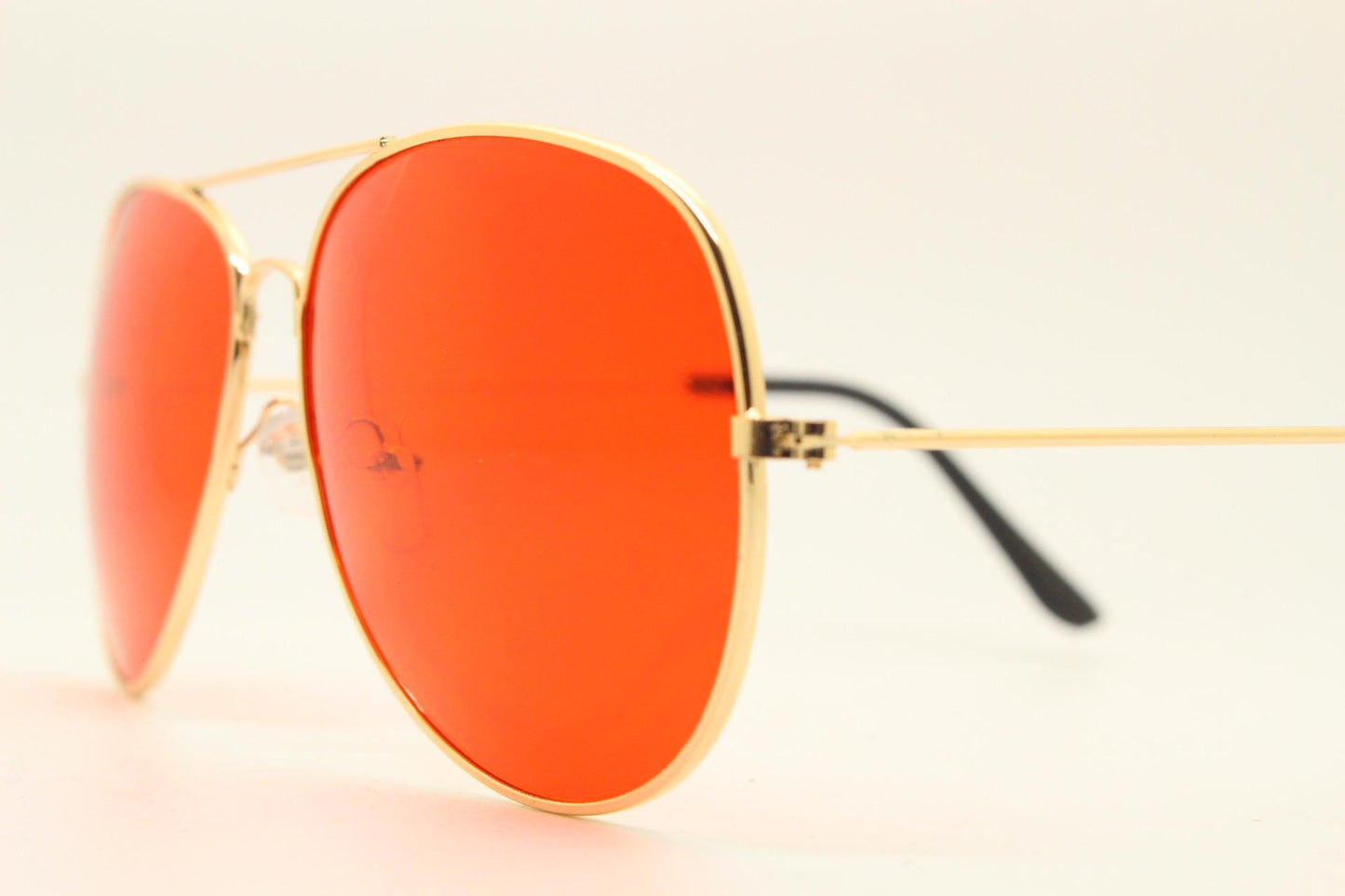 Y2K vintage teardrop aviator sunglasses. Gold chrome metal frame 70s design aviators with intense red lenses. 2000s. Unused NOS