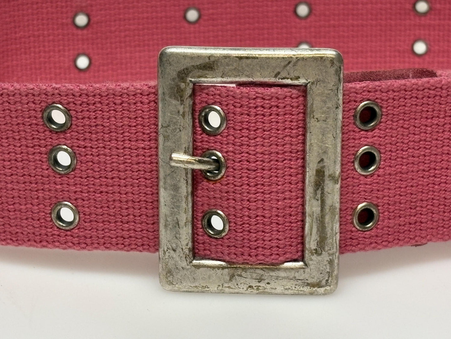 Y2k vintage thick candy pink army style belt with distressed metal buckle and 3 rows of lace holes. Statement feature / to cinch a dress