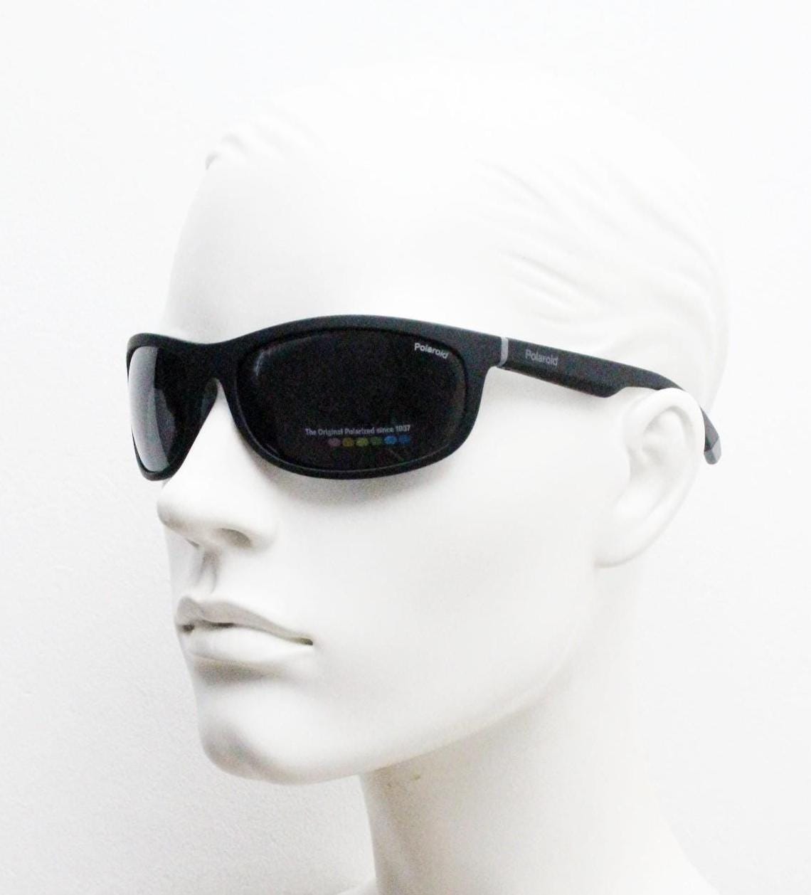 Polaroid vintage sports shield sunglasses. Black rubber finish curved wrap around frame with polarising lenses. 2000s. Y2K. Bug eye. NOS